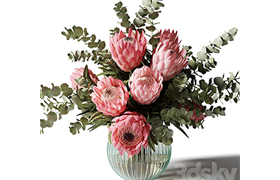 Bouquet with pink proteas and eucalyptus in a ribbed glass